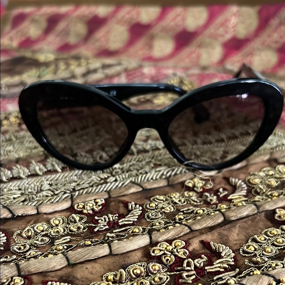Prada - Black and white cateye sunglasses. One size